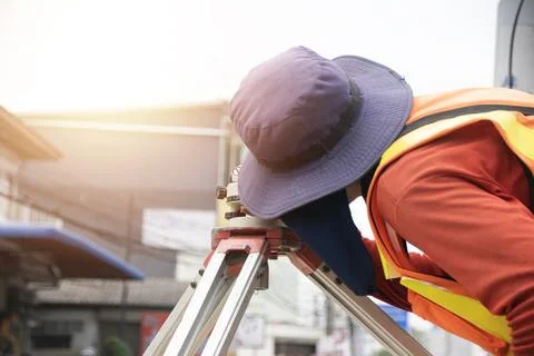 Engineers are using cameras to measure levels. Stock Photos