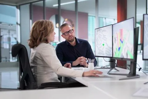 Engineers Are Using GIS Software To Inspect Construction Project Valuation. Stock Photos