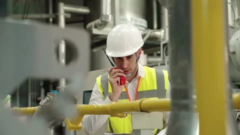 Engineers are using radio communication to coordinate machine check Stock Footage 150863297