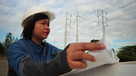 Engineers are working outdoors to check the wind turbine system Stock Footage 144892835