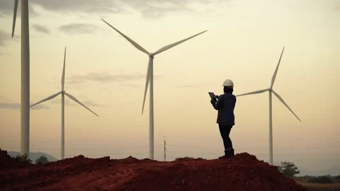Engineers are working outdoors to check the wind turbine system Stock Footage 144896387