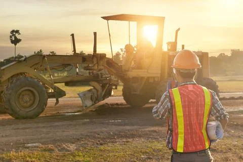 Engineers are working on road construction. engineer holdingradio communicati Stock Photos