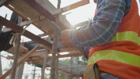 Engineers are writing down the details of the construction on paper. The cont Vídeo Stock 217957640
