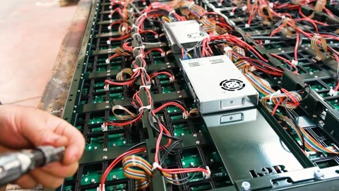 Engineers assembling an electronic circuit and LED screen 動画素材 292025309