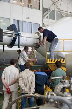 Engineers attach the escape tower to the Soyuz TMA-09M spacecraft during a... Stock Photos