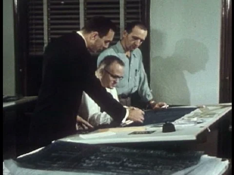 Engineers with blueprints plan for the future at the Cleveland Electric Stock Footage 75284918