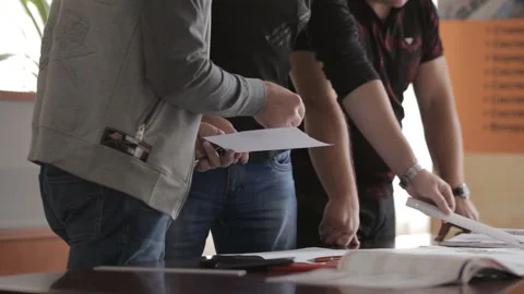 Engineers-builders communicate with each other when creating a project. Stock Footage 92243200