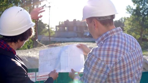 Engineers builders at the construction site are planning construction Stock Footage 78531626