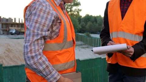 Engineers builders at the construction site are planning construction Stock Footage 78531700