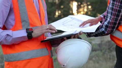 Engineers builders plan to build a house on a construction site. Stock Footage 170696962