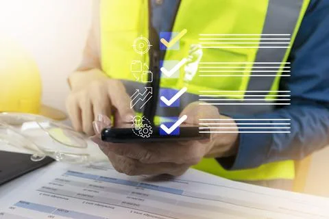 Engineers check the checklist for correctness of production parts and ongoi.. Stock Photos