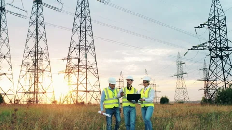 Engineers check power grids. Electric industry, electrical energy production Video stock 138815187