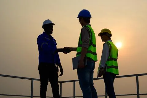 Engineers checking solar panels on solar power plant Stock Photos