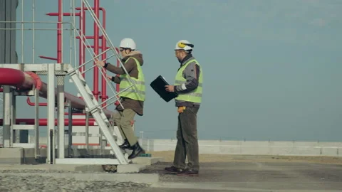 Engineers climb special platform at power electric station Stock Footage 143080319