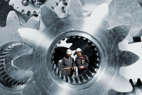 Engineers with cogs and gears Stock Illustration