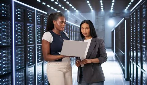 Engineers Collaborate Closely On Laptops, Managing Secure Cloud Systems Toget 写真素材