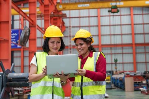 Engineers Collaborating with Laptop in Factory: Practical Training and Tech.. Stock Photos