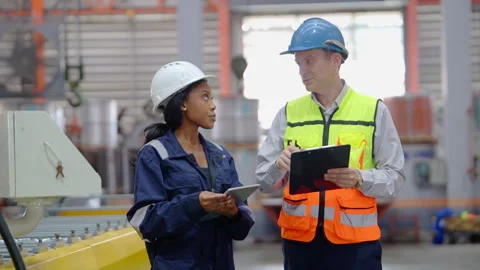 Engineers Conducting Quality Control Audit in Industrial Factory Stock Footage 343307841