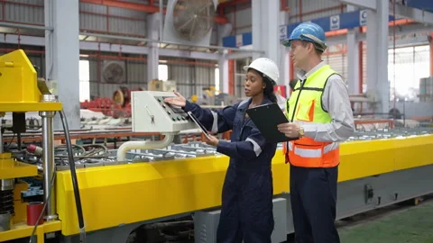 Engineers Conducting Quality Control Audit in Industrial Factory Stock Footage 343308998
