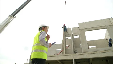 Engineers construction projects inspect and supervise the construction Stock Footage 309938225
