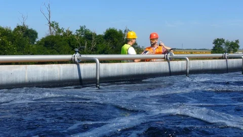 Engineers controlling a quality of water Stock Footage 125080208