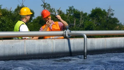 Engineers controlling a quality of water Stock Footage 125080234