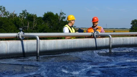 Engineers controlling a quality of water Stock Footage 125080562