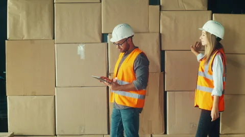 Engineers Coordinating Project on Site, Reviewing Plans Construction Details Stock Footage 311576771