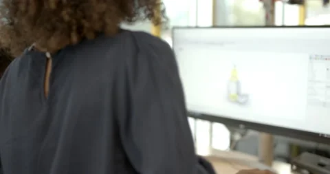 Engineers in creative office looking at 3d printer and model Stock Footage 165081485