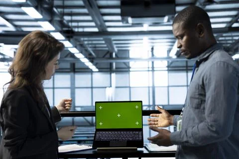 Engineers in data center using isolated screen mockup laptop Stock Photos