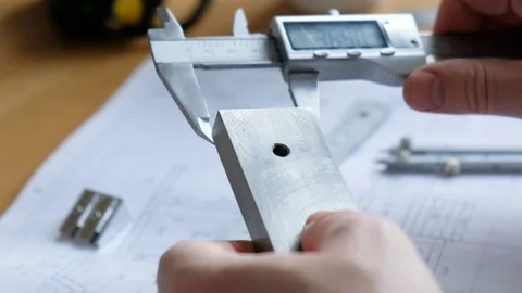 Engineer's desk: drawings, beam compasses, ruler and other drawing tools Stock Footage 128307057