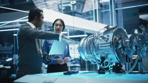 Engineers Developing Turbine Engine Video stock 229843694