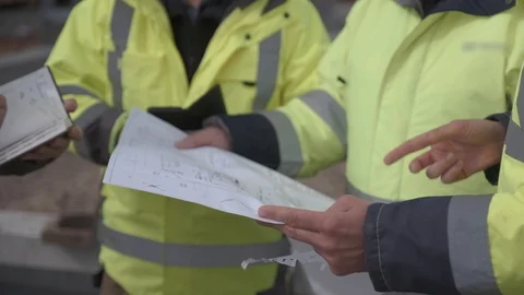 Engineers discuss building plan Video stock 129235153