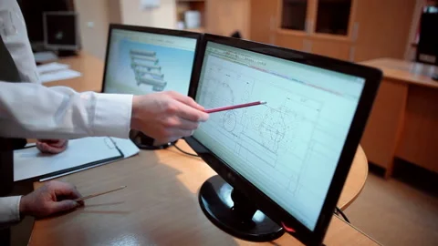 Engineers discuss drawing Stock Footage 91921078