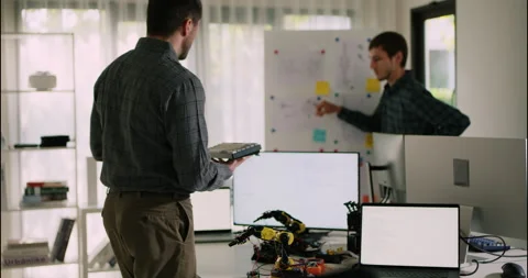 Engineers Discuss Robotic Arm Project in Lab. Stock Footage 306736648