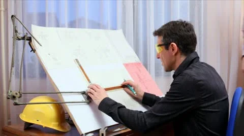 Engineers discussing and working Stock Footage 24660090