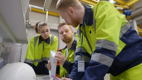 Engineers discussing the detail Video stock 109337696