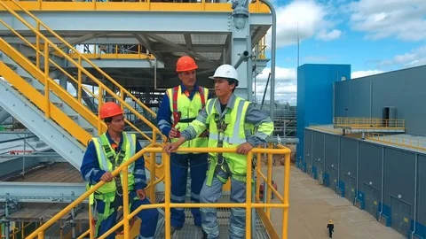 Engineers discussing a new project. Large industry background Stock Footage 72071825