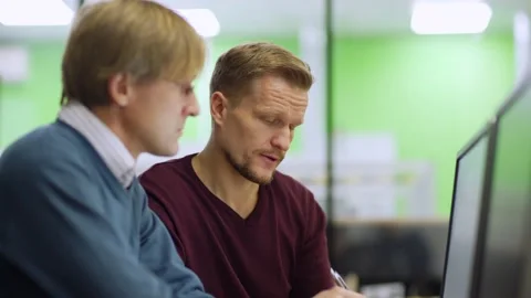 Engineers discussing project at workplace Stock Footage 142163048