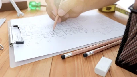 Engineers drawing Mechanical on the wood table Stock Footage 115880547