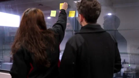 Engineers during a cretive brainstorming using adhesive notes Stock-Footage 262107615