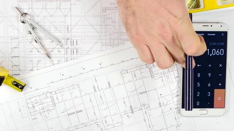 Engineers fix errors on drawings, and discuss cooperation. Close up Stock Footage 73676301