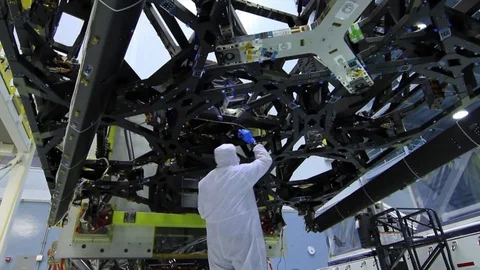 Engineers Flashes torch on the Webb Telescopes Structure and Examines it - 2016 Stock Footage 112132936