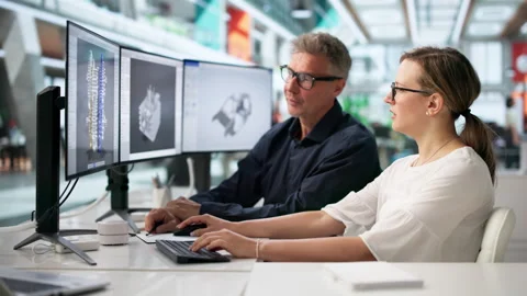 Engineers Focused On 3D Car Gearbox Design Stock Footage 335876543