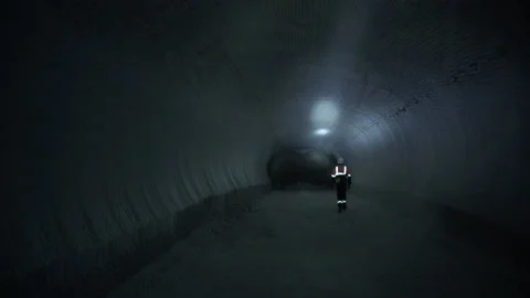 Engineers of geology and mining walking inside tunnel mine Stock-Footage 147238059