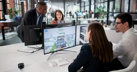 Engineers On GIS Team Using Design Software For Mapping Land. Stock Photos
