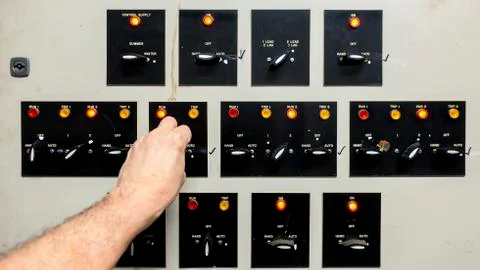 Engineers hand adjusting a very old looking control panel Stock Photos