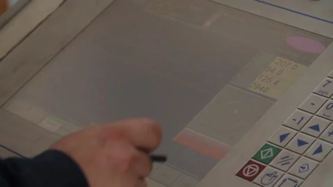 Engineer's hands operating complex industrial control panel with stylus buttons. Video stock 313815284
