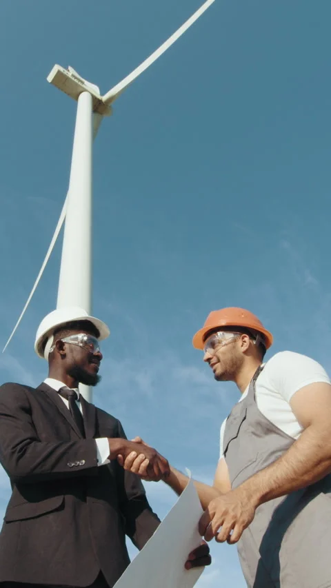 Engineers Handshake by Wind Turbine Stock Footage 318626679
