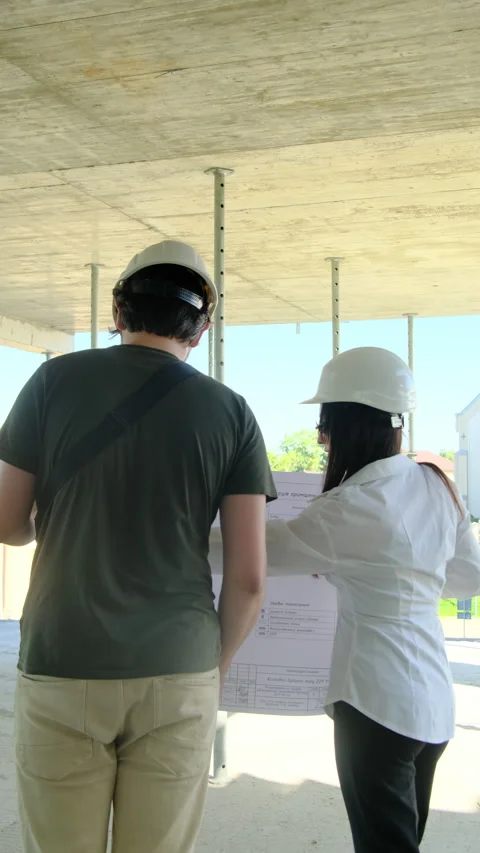 Engineers inspect floor plan and special area in building Stock Footage 317621443